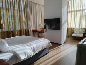 Μια τηλεόραση ή/και κέντρο ψυχαγωγίας στο Chongqing Justom Family Serviced Apartments12