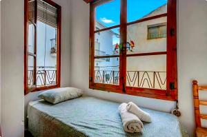 Giường trong phòng chung tại Amarilla