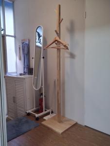 a room with a surfboard on a stand next to a mirror at Ito - Cottage - Vacation STAY 19055 in Ito