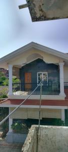 a house with a pole in front of it at Pushpa Nilaya in Madikeri