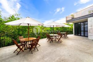 Un balcón o terraza en Merin Villa by Kozystay - Jimbaran