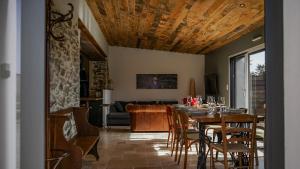 a dining room with a table and chairs at Le Chai des Poilanes in Liré