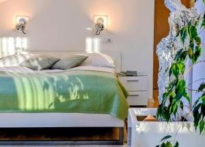 Postel nebo postele na pokoji v ubytování Garden Apartments Janša