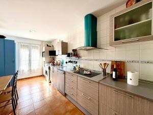 a kitchen with a sink and a counter top at La Casa de las Nereidas in Cuenca +36 photos