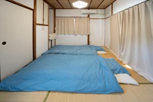 En eller flere senge i et værelse på Yuハウス-宇美町-