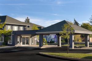a house with a gazebo on a street at Spark by Hilton Toronto Mississauga in Mississauga