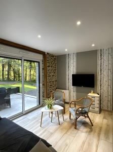 TV a/nebo společenská místnost v ubytování Gite Ranch