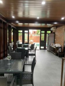 a restaurant with tables and chairs and a dining room at Maison Duyên in Hue