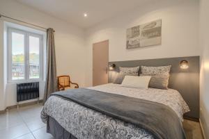 Ένα ή περισσότερα κρεβάτια σε δωμάτιο στο La meulière de Guerlande - Disney 20min