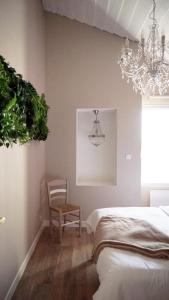 Ένα ή περισσότερα κρεβάτια σε δωμάτιο στο Le Chai des Poilanes