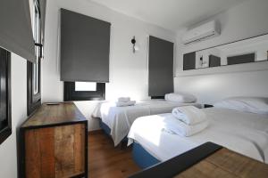 Postel nebo postele na pokoji v ubytování Gestema Luxury Residences + 52 fotografií