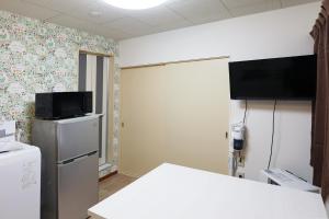 Μια τηλεόραση ή/και κέντρο ψυχαγωγίας στο Vivere103ー札幌市地下鉄南平岸駅徒歩3分ーS-beds2 +20 φωτογραφίες