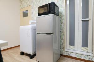 Η κουζίνα ή μικρή κουζίνα στο Vivere103ー札幌市地下鉄南平岸駅徒歩3分ーS-beds2