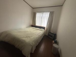 Postel nebo postele na pokoji v ubytování 白馬樹海