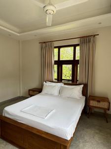 Ένα ή περισσότερα κρεβάτια σε δωμάτιο στο Kirala House - Unawatuna