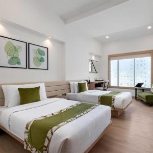 Ένα ή περισσότερα κρεβάτια σε δωμάτιο στο Hotel N NYSHA Plaza Near IGI International Airport