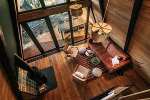 an overhead view of a living room with a couch and chairs at УЛІС Ворохта in Vorokhta