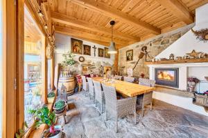 a dining room with a wooden table and chairs at Chaloupka Ovčárna in Jindrichuv Hradec +16 photos