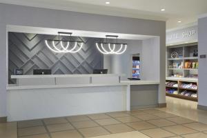 a store checkout counter in a store with lights at Homewood Suites by Hilton Toronto Vaughan in Vaughan