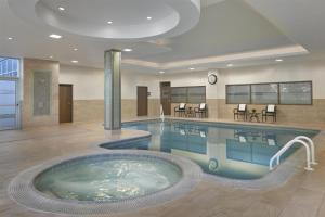 a large swimming pool in a hotel room at Homewood Suites by Hilton Toronto Vaughan in Vaughan