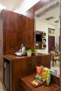a kitchen with a counter with food on it at Hotel Tej Plaza FREE Airport Drop in New Delhi +21 photos