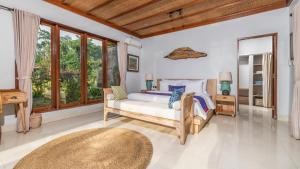 Postel nebo postele na pokoji v ubytování Umah Sunset + 59 fotografií