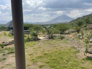 a view of a mountain from a house at Lake Natron Maasai Guesthouse in Mtowabaga