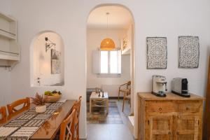 a kitchen with a counter and a table with a coffee maker at GiSt in Livadi Astypalaias