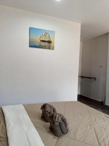 Ένα ή περισσότερα κρεβάτια σε δωμάτιο στο เจ๊สวนบังกะโล