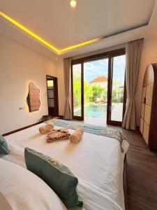 Ένα ή περισσότερα κρεβάτια σε δωμάτιο στο Nairi Villa Ungasan