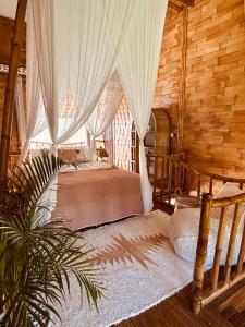 Ένα ή περισσότερα κρεβάτια σε δωμάτιο στο Casa Bamboo uluwatu 2