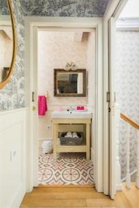 a bathroom with a sink and a mirror at Casa de Carmen in Corcubión +17 photos