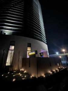a building at night with lights in front of it at ホテルクレアトゥール安城 in Wada