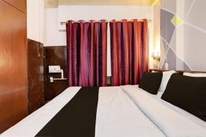 Postel nebo postele na pokoji v ubytování Super Hotel O Green Park Residency