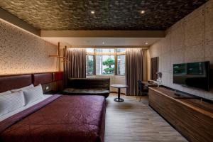 TV a/nebo společenská místnost v ubytování King & Princess Motel - Rende + 38 fotografií