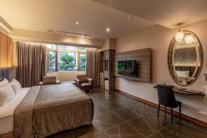 TV a/nebo společenská místnost v ubytování King & Princess Motel - Rende