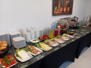 a table with plates of food on it at HAVANA in Lublin