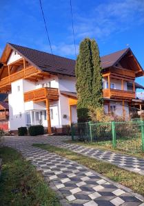 a large white house with a black roof at Pensiunea Casa-Stefanel in Sadova