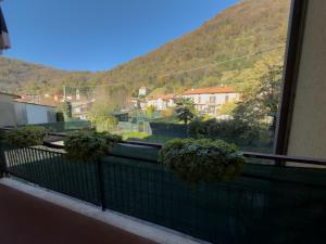 a balcony with a view of a mountain at Quiet Home in Val Brona in Valbrona
