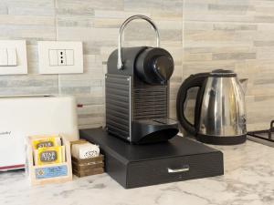 a coffee maker sitting on top of a counter at Quiet Home in Val Brona in Valbrona
