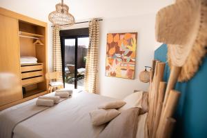 Postel nebo postele na pokoji v ubytování Alma Ventura House - Majanicho