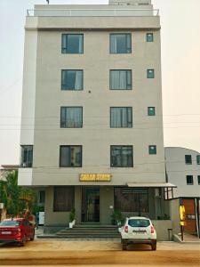 a building with a car parked in front of it at Sagar Stays in Jaipur