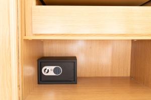 a small radio in a cabinet in a room at Alma Ventura House - Majanicho in Majanicho +37 photos