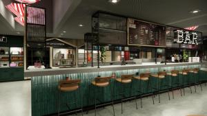 um restaurante com um bar com cadeiras castanhas em Moxy Zurich em Zurique