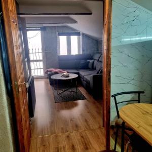 a living room with a couch and a table at Dom Kopernica 5 in Chełm +18 photos