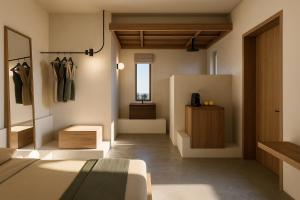 una habitación con una cama y un tocador. en Faos Kea Boutique Hotel, en Koundouros