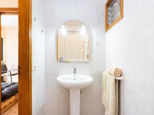 a bathroom with a sink and a mirror at Live Salinas 3 in Caleta de Interián