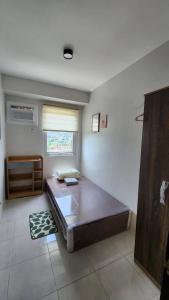 a bedroom with a large bed in a room at Ann Cozy Living in Cebu City