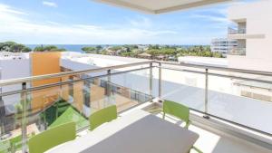 a balcony with chairs and a view of the ocean at Alfagar Prestige in Albufeira