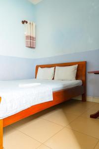 Ένα ή περισσότερα κρεβάτια σε δωμάτιο στο Việt Anh Hotel